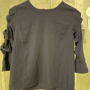 Brand new navy top with bow details on sleeve.
